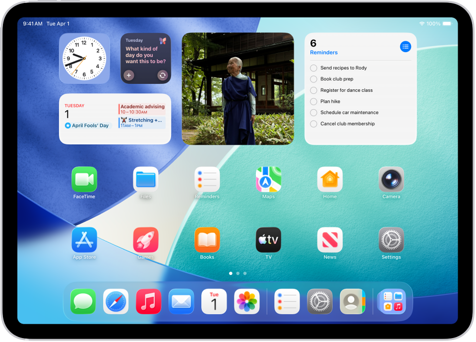 iPad home screen featuring large widgets for Reminders, Clock, and Photos, alongside a dock showing active applications for multitasking.