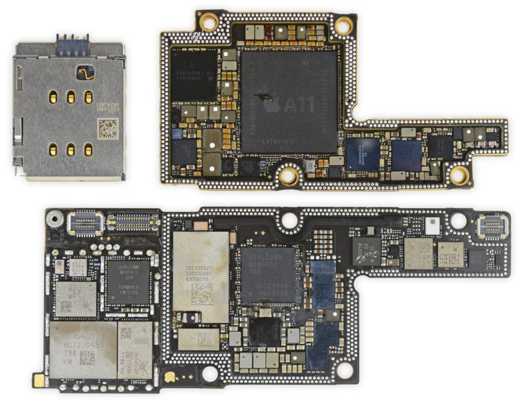  Close-up of Apple-designed silicon integrated into an iPhone motherboard.