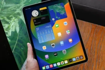 An iPad Pro showing the App Switcher multitasking view on a desk with blue-green Guide4Mac brand lighting