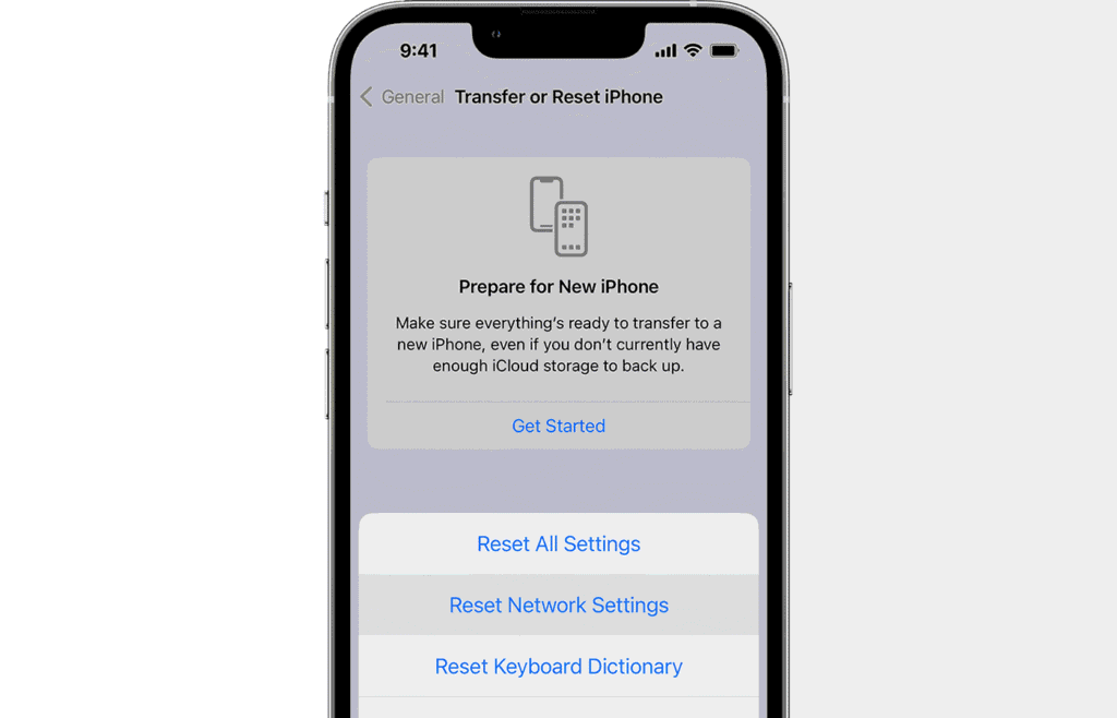 Screenshot of an iPhone display showing the "Transfer or Reset iPhone" menu with the "Reset Network Settings" option highlighted in the pop-up menu.