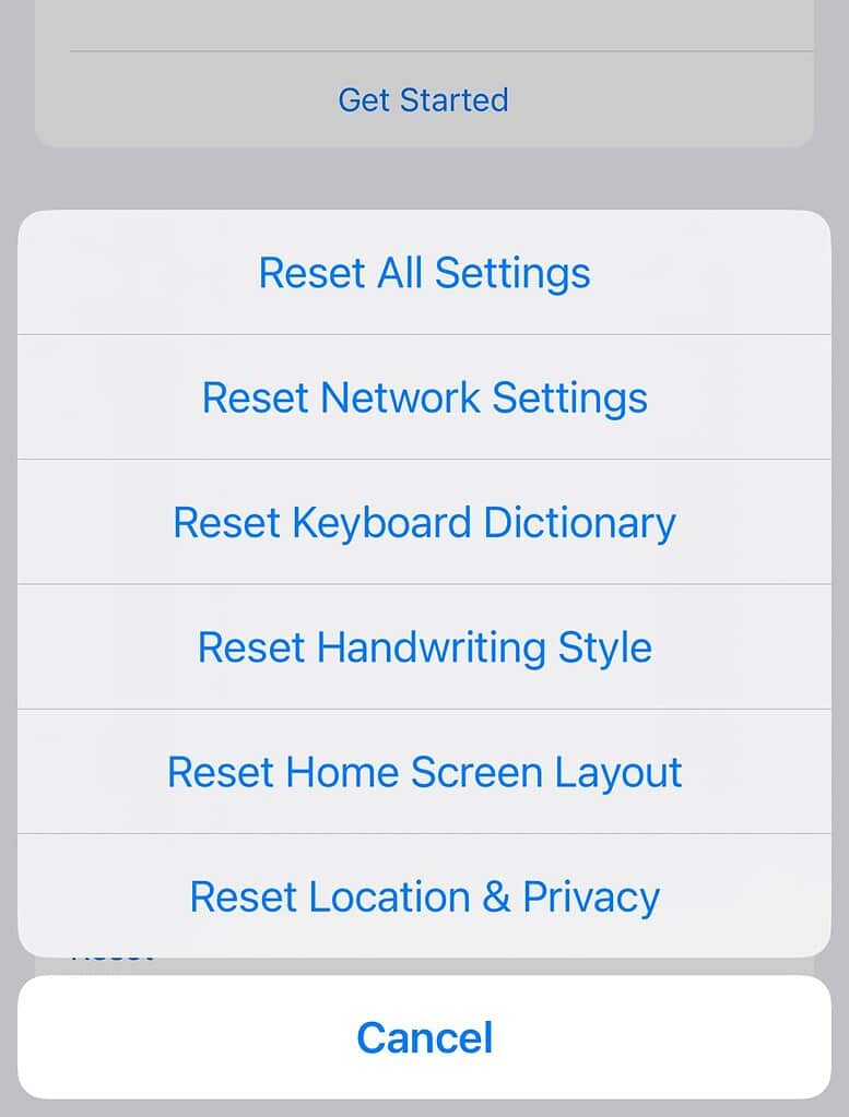 OS settings menu showing various reset options including Reset All Settings, Reset Network Settings, and Reset Home Screen Layout on an iPhone.